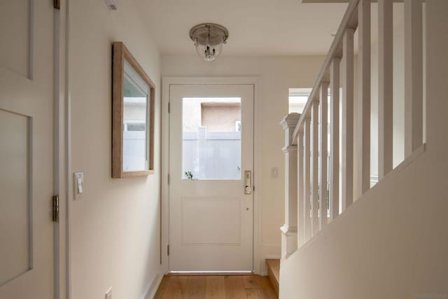 doorway with light wood-type flooring