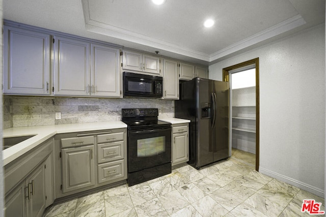 kitchen featuring decorative backsplash, black appliances, gray cabinets, and crown molding