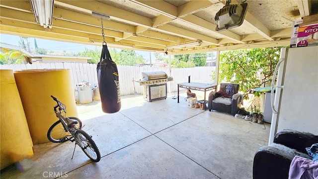 view of patio / terrace with ceiling fan and area for grilling