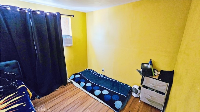 bedroom with wood-type flooring