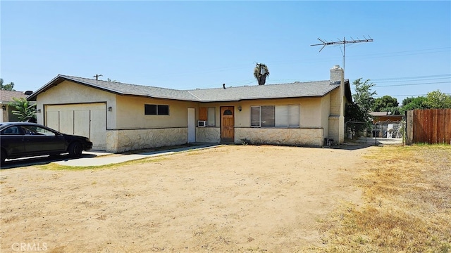 single story home featuring a garage