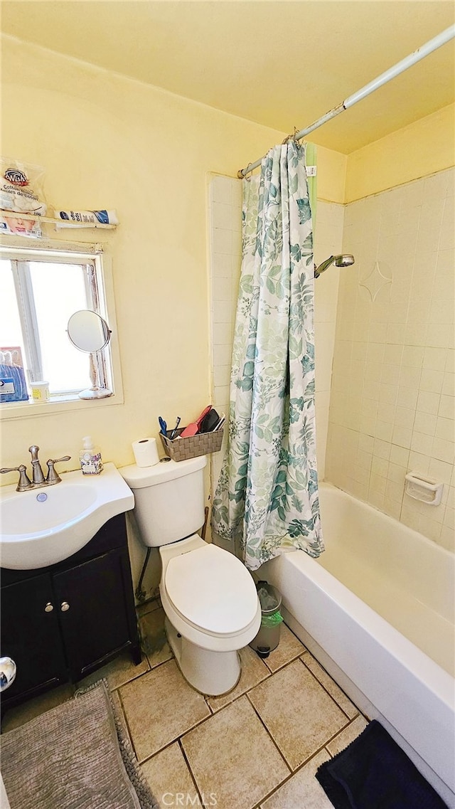 full bathroom with shower / bathtub combination with curtain, toilet, vanity, and tile patterned floors