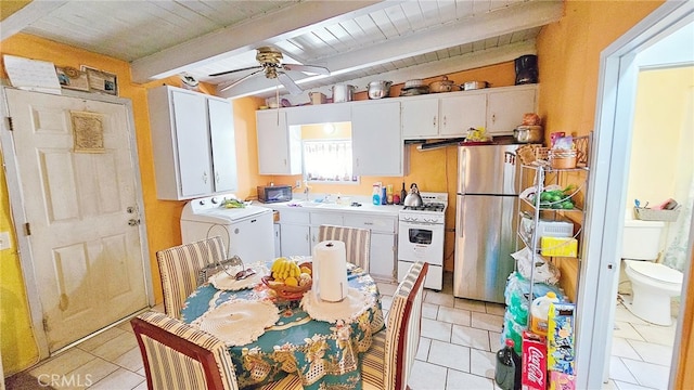 kitchen featuring beamed ceiling, white cabinets, stainless steel refrigerator, white range with gas cooktop, and ceiling fan