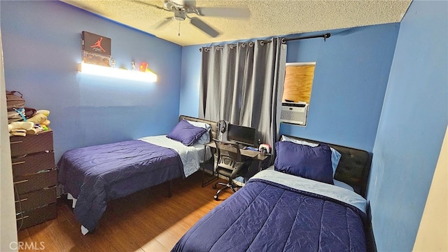 bedroom with a textured ceiling, wood-type flooring, ceiling fan, and cooling unit