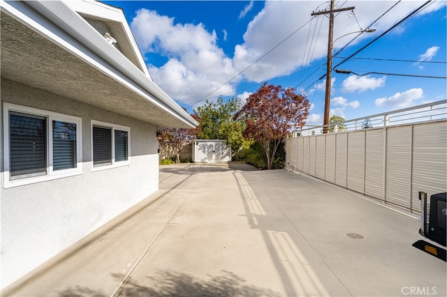 view of patio with a shed