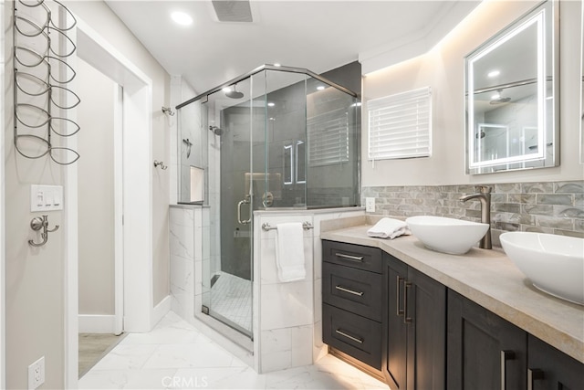 bathroom featuring tile walls, walk in shower, and vanity