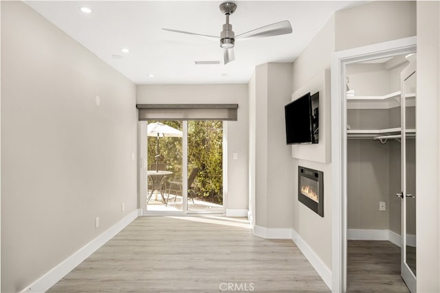 hall with light hardwood / wood-style floors