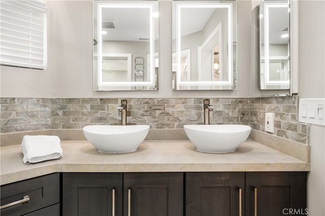 bathroom with backsplash and vanity