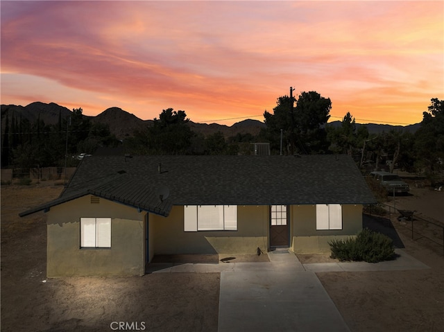 view of front of property with a mountain view