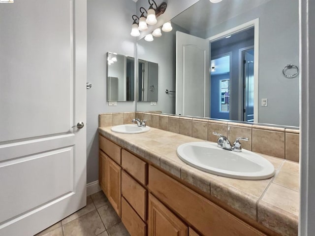 bathroom with tile patterned flooring and vanity