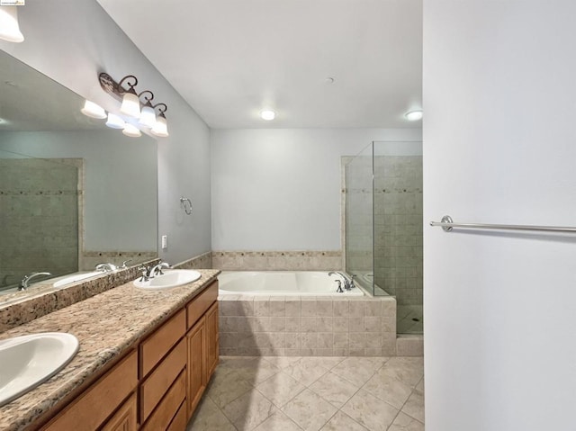 bathroom with vanity and independent shower and bath