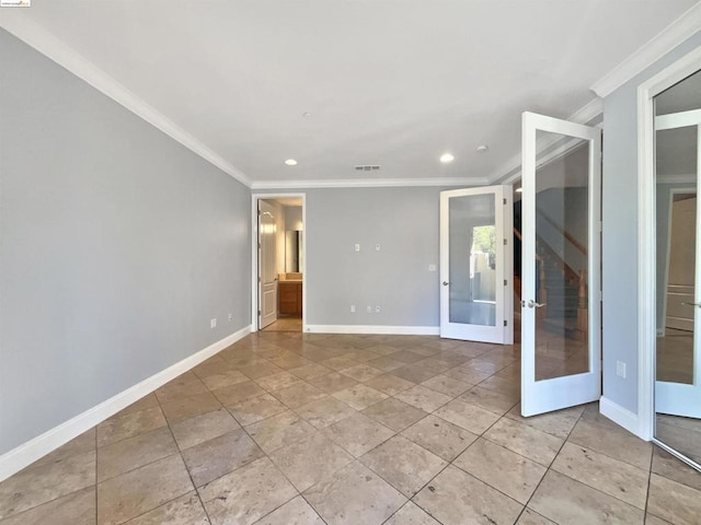 spare room featuring crown molding and french doors