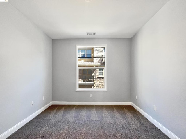 empty room featuring carpet flooring