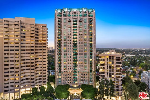 view of outdoor building at dusk