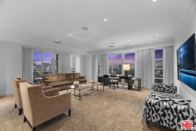 living room with a healthy amount of sunlight, crown molding, and light carpet