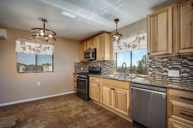 kitchen with hanging light fixtures, sink, a chandelier, and stainless steel appliances