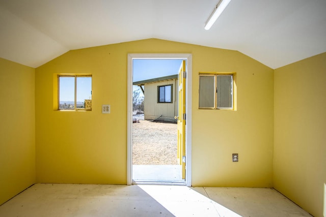 additional living space featuring lofted ceiling