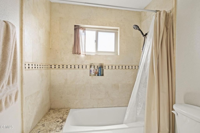 bathroom with shower / bathtub combination with curtain and toilet