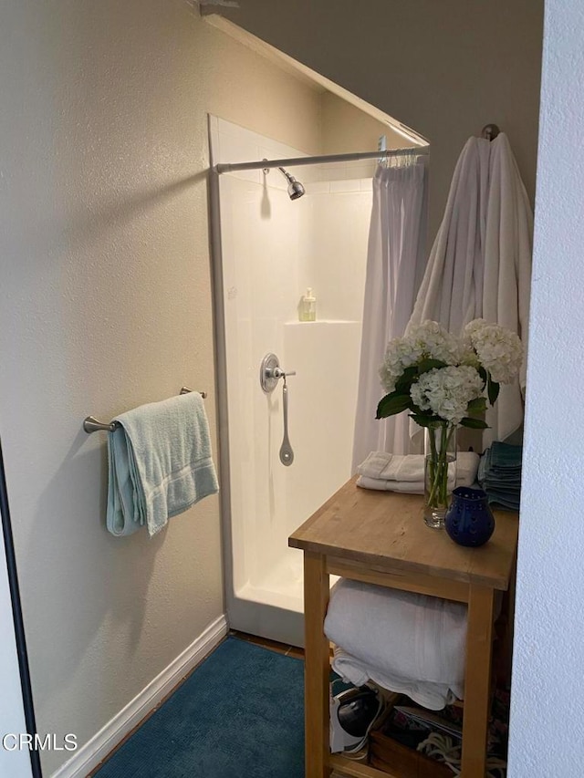 bathroom featuring walk in shower