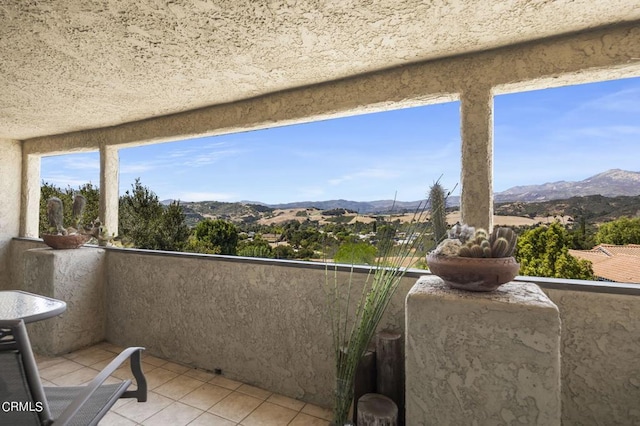 balcony featuring a mountain view