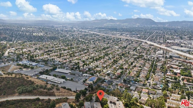 drone / aerial view featuring a mountain view