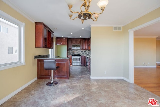 kitchen featuring a breakfast bar, hanging light fixtures, ornamental molding, a notable chandelier, and stainless steel appliances