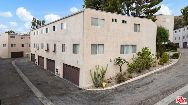 view of building exterior featuring a garage