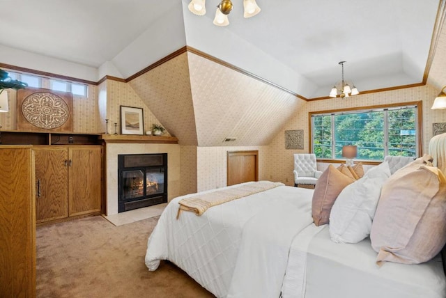 carpeted bedroom featuring vaulted ceiling and a notable chandelier