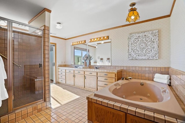 bathroom with vanity, ornamental molding, tile patterned floors, and shower with separate bathtub