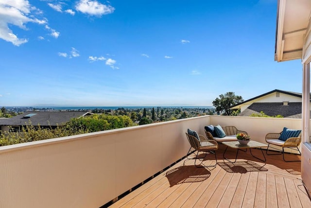 wooden deck with an outdoor living space