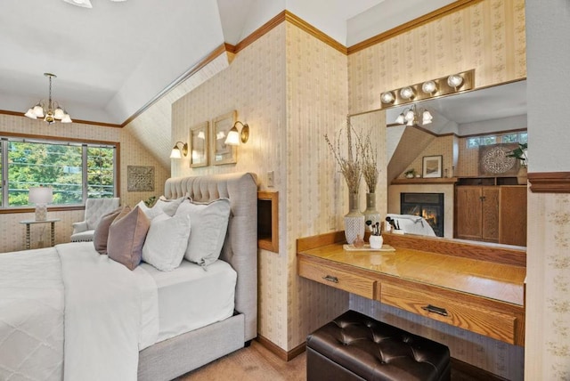 bedroom featuring lofted ceiling and a notable chandelier