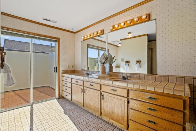 bathroom with ornamental molding, tile patterned flooring, and vanity