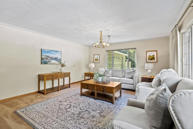 living room with ornamental molding, a chandelier, carpet, and a textured ceiling