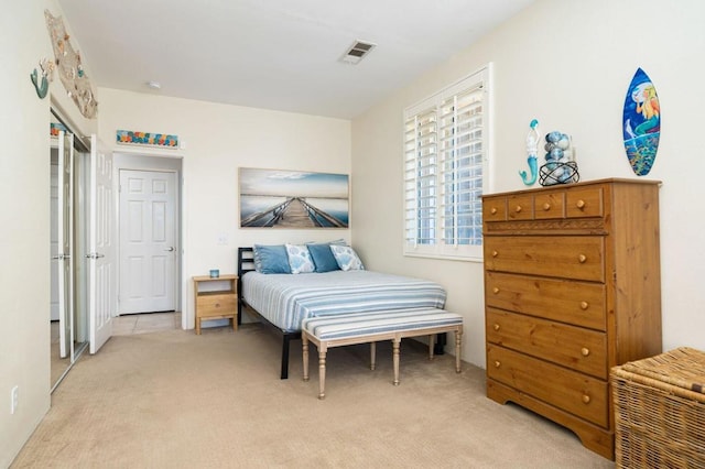 carpeted bedroom featuring a closet