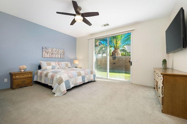 bedroom featuring access to outside, ceiling fan, and light carpet