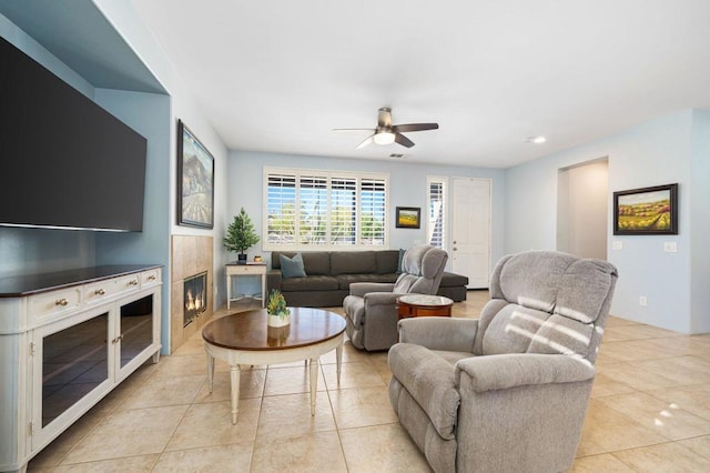 tiled living room featuring ceiling fan