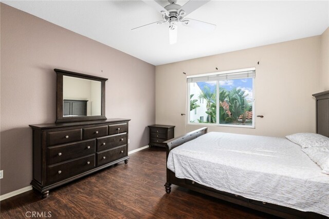 bedroom with ceiling fan and dark hardwood / wood-style flooring