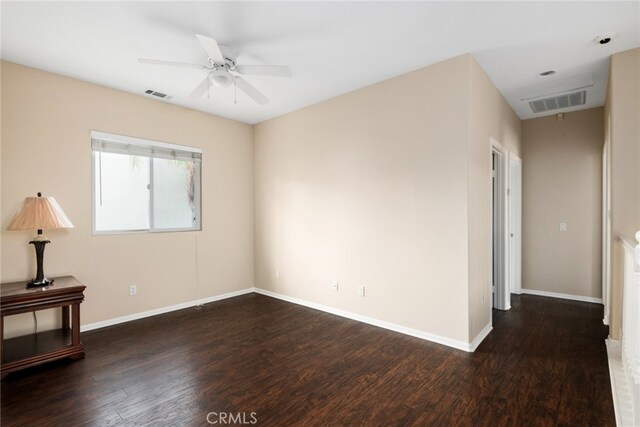 unfurnished room featuring dark hardwood / wood-style floors and ceiling fan