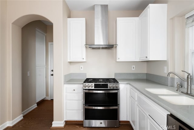 kitchen featuring white cabinetry, sink, wall chimney exhaust hood, and stainless steel appliances