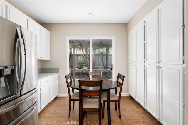 dining area with light hardwood / wood-style floors