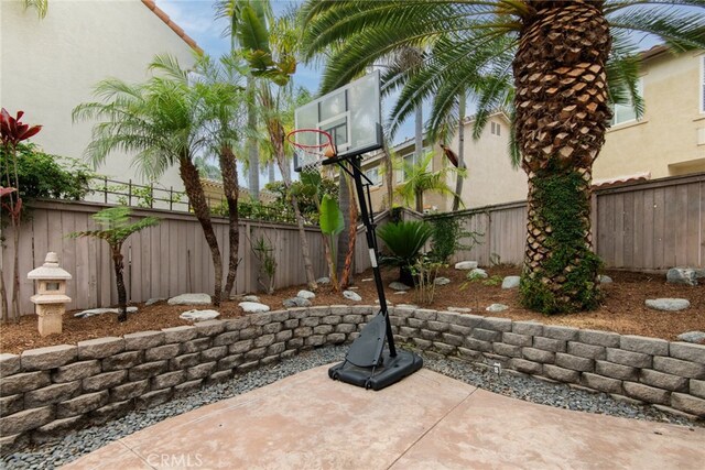 view of patio / terrace featuring basketball hoop