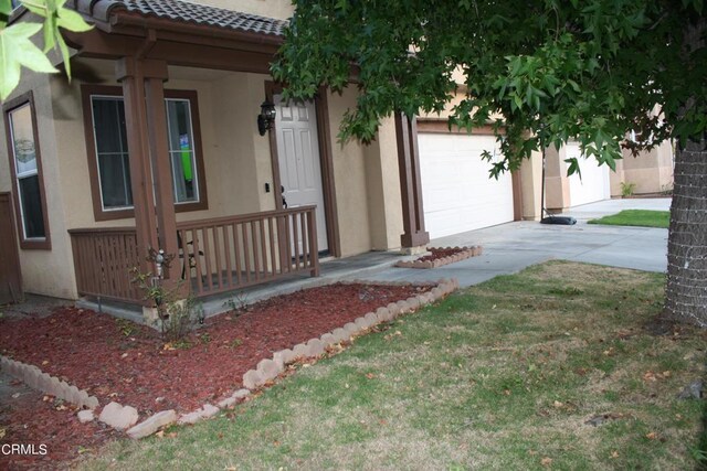 view of front facade with covered porch and a garage