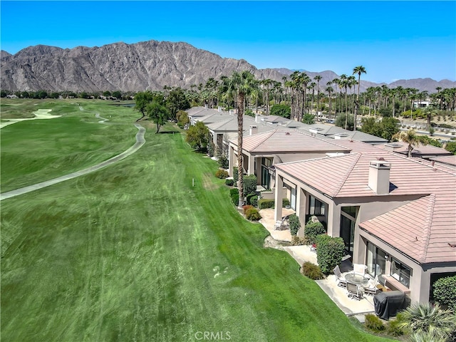 birds eye view of property featuring a mountain view