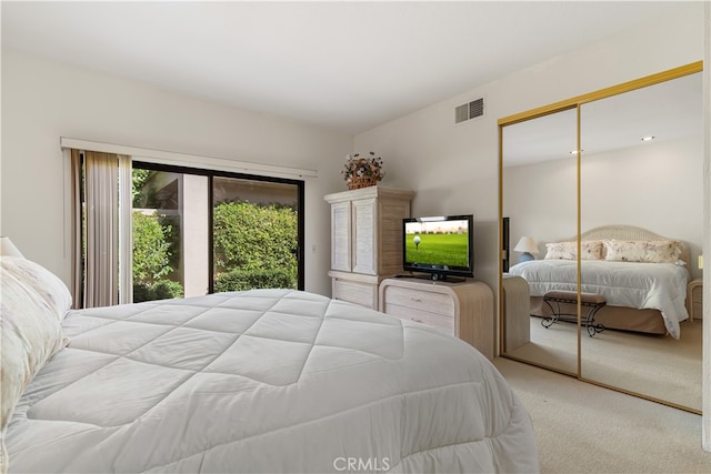 carpeted bedroom with a closet