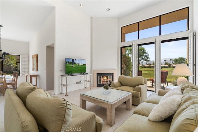 tiled living room featuring a towering ceiling