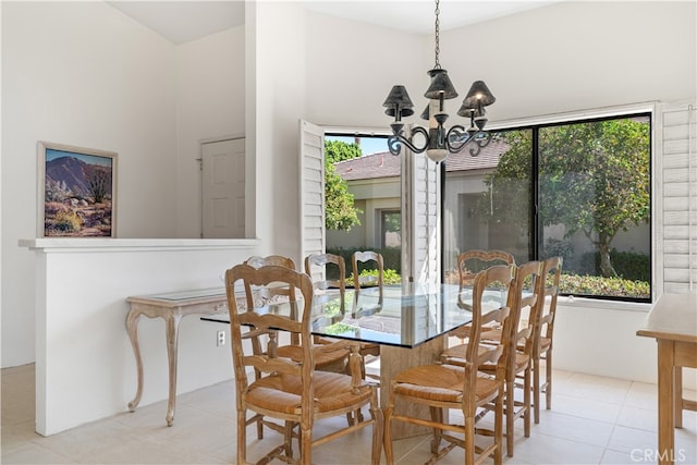 dining room featuring light tile patterned floors, a chandelier, and a wealth of natural light