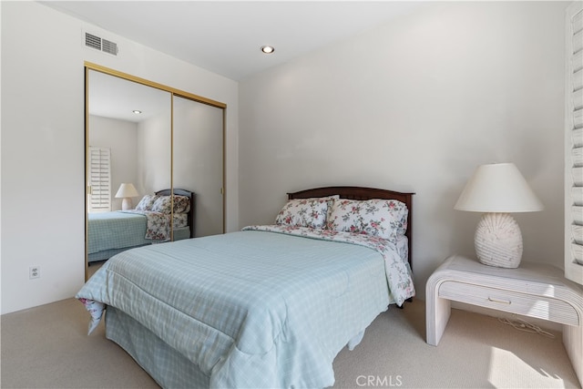 bedroom with a closet and carpet flooring