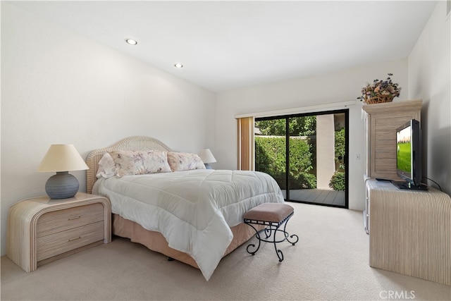 bedroom featuring access to outside and light colored carpet