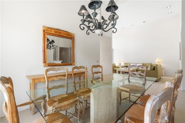 dining area featuring a notable chandelier and light tile patterned floors