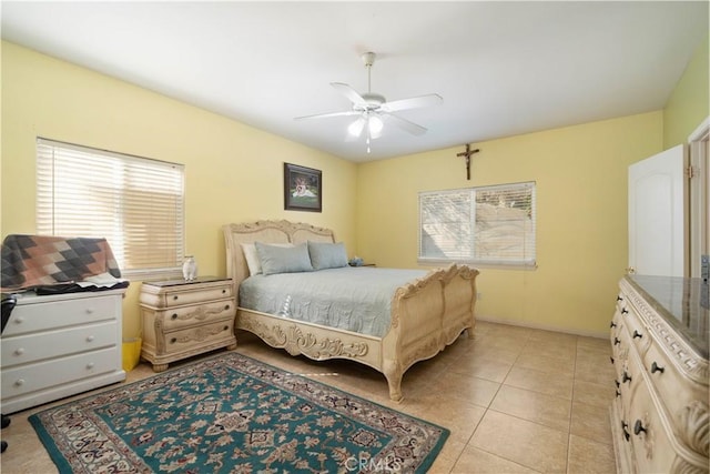 tiled bedroom with ceiling fan